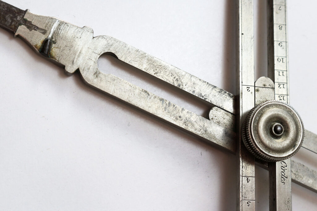 William Elliott Great Portland Street proportional dividers - detail of abrasions and surface indentation to the malleable alloy