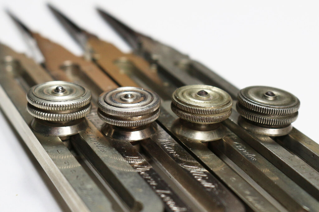 Comparison of four William Elliott proportional dividers - locking nut details