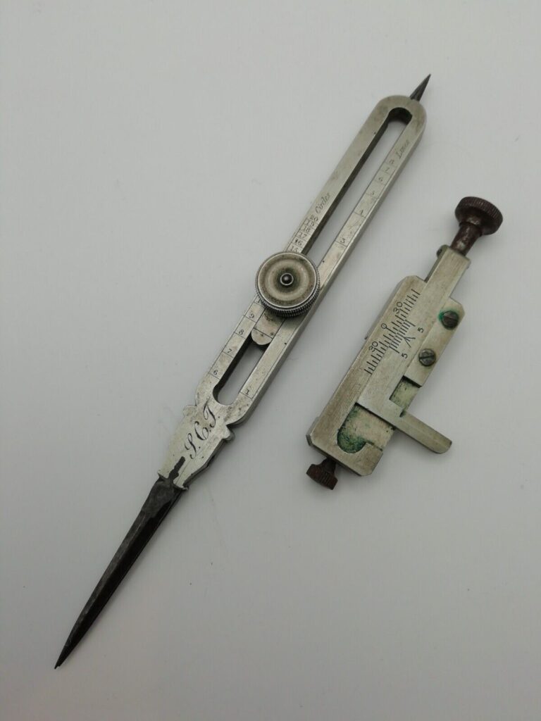 William Elliott Great Newport Street proportional dividers auction photo with unrelated vernier gauge (ventometer)