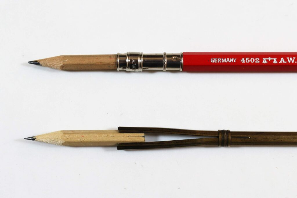 Detail comparison of A.W. Faber 4502 pencil extender and traditional porte-crayon holder with identical pencil stubs