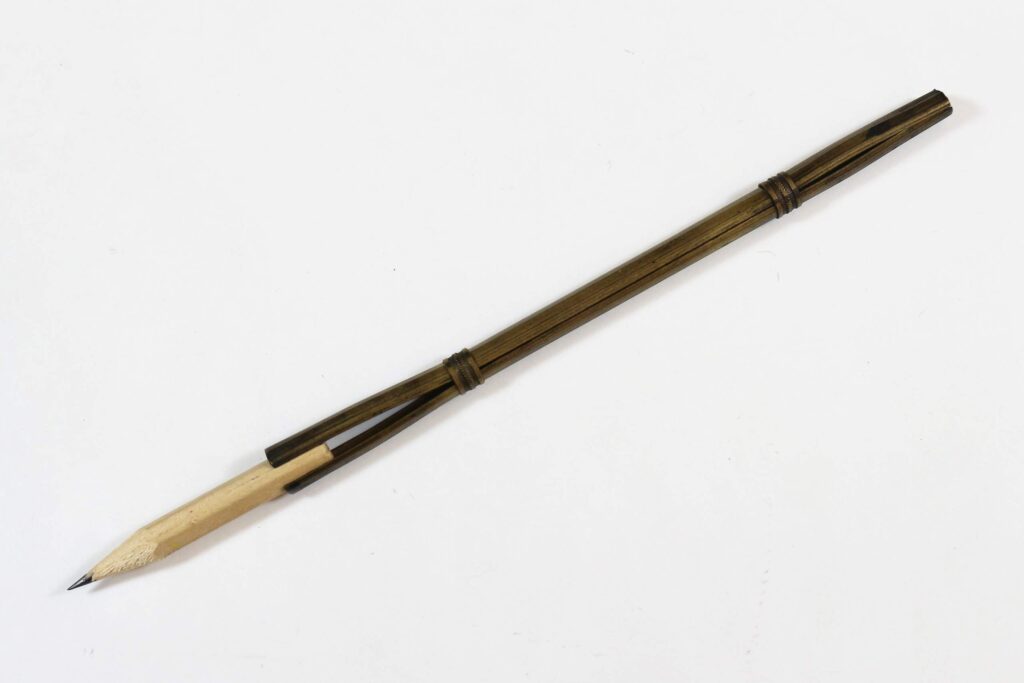 Traditional brass porte-crayon holder fitted with pencil stub